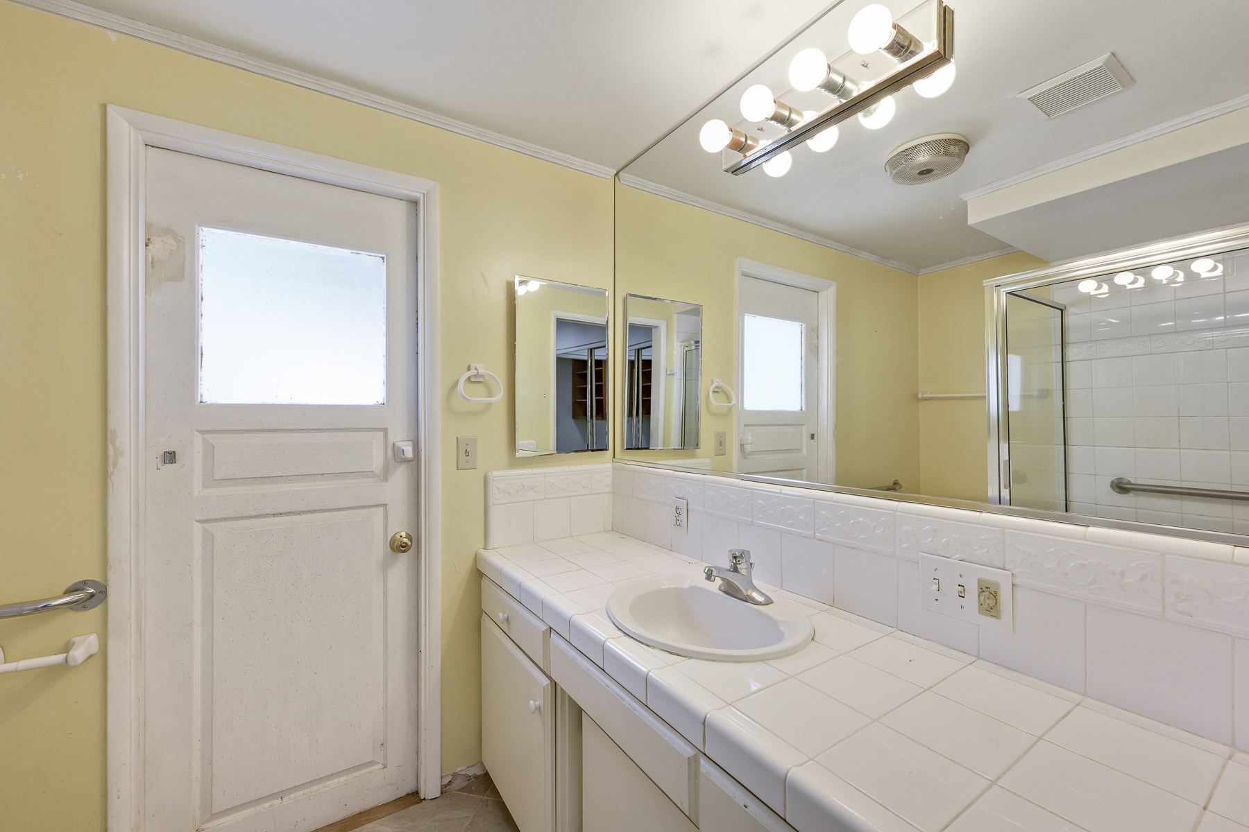 1337 Sheppard Drive, Fullerton, CA 92831 bathroom with exterior door and vanity