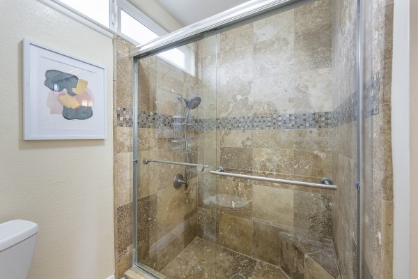 Bathroom - Walk-in tile shower with windows at the top of the walll