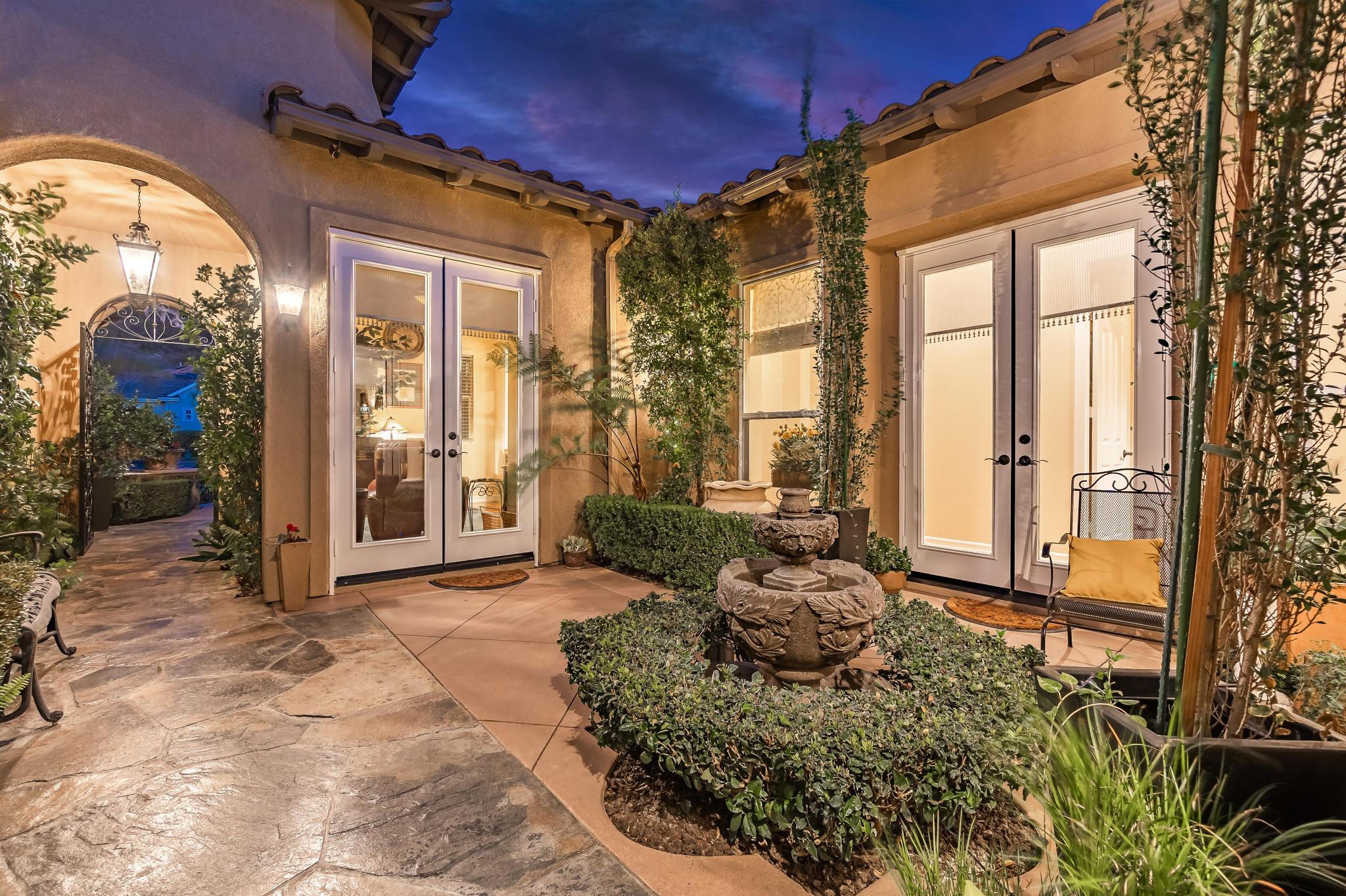 Tuscan-Inspired Olinda Ranch Villa – 467 Tangerine Place, Brea, CA 92823 - Angled View of Front French Doors and Entrance Gate with Fountain