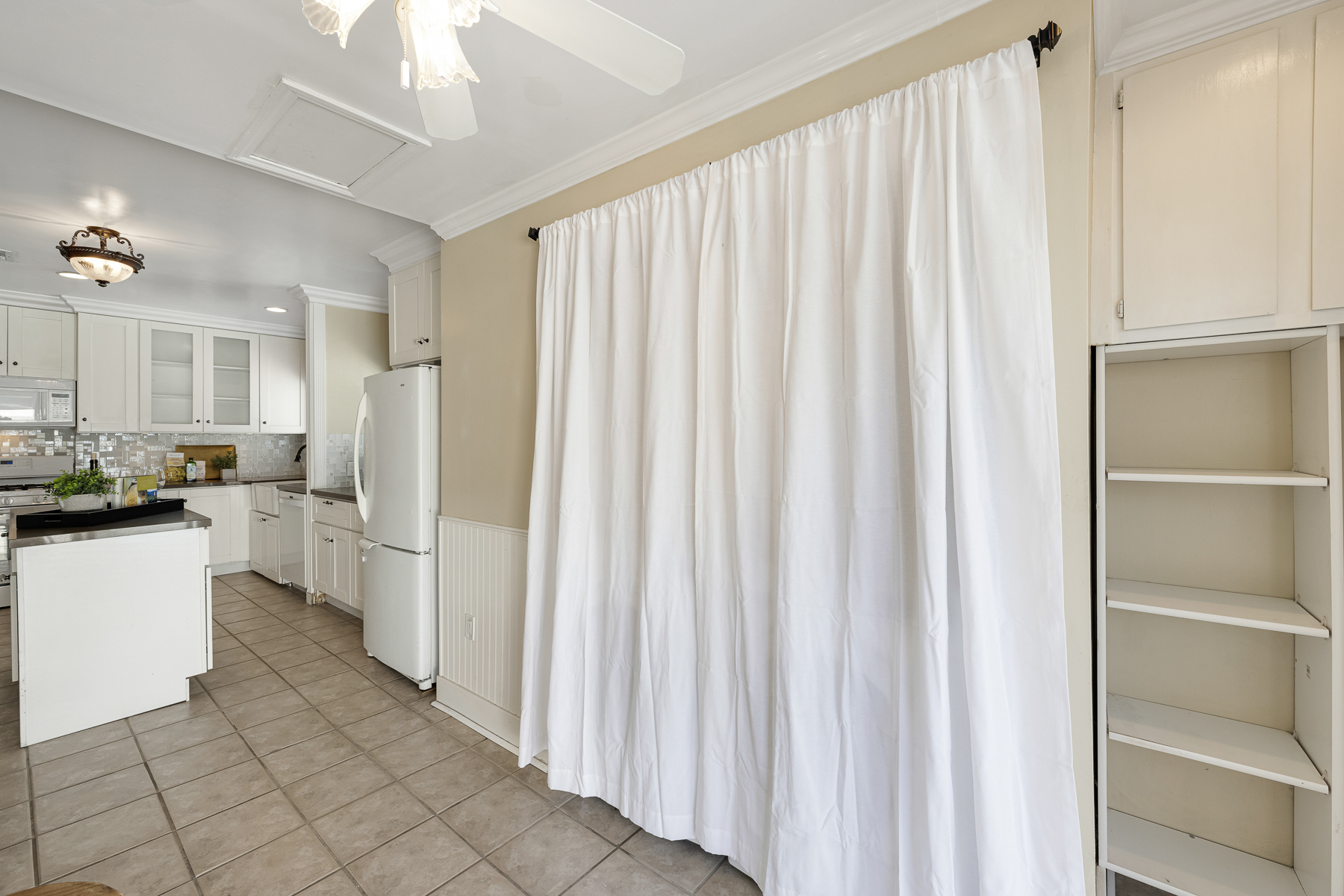 1229 Grove Place Fullerton CA 92831: Hallway looking into kitchen with curtain