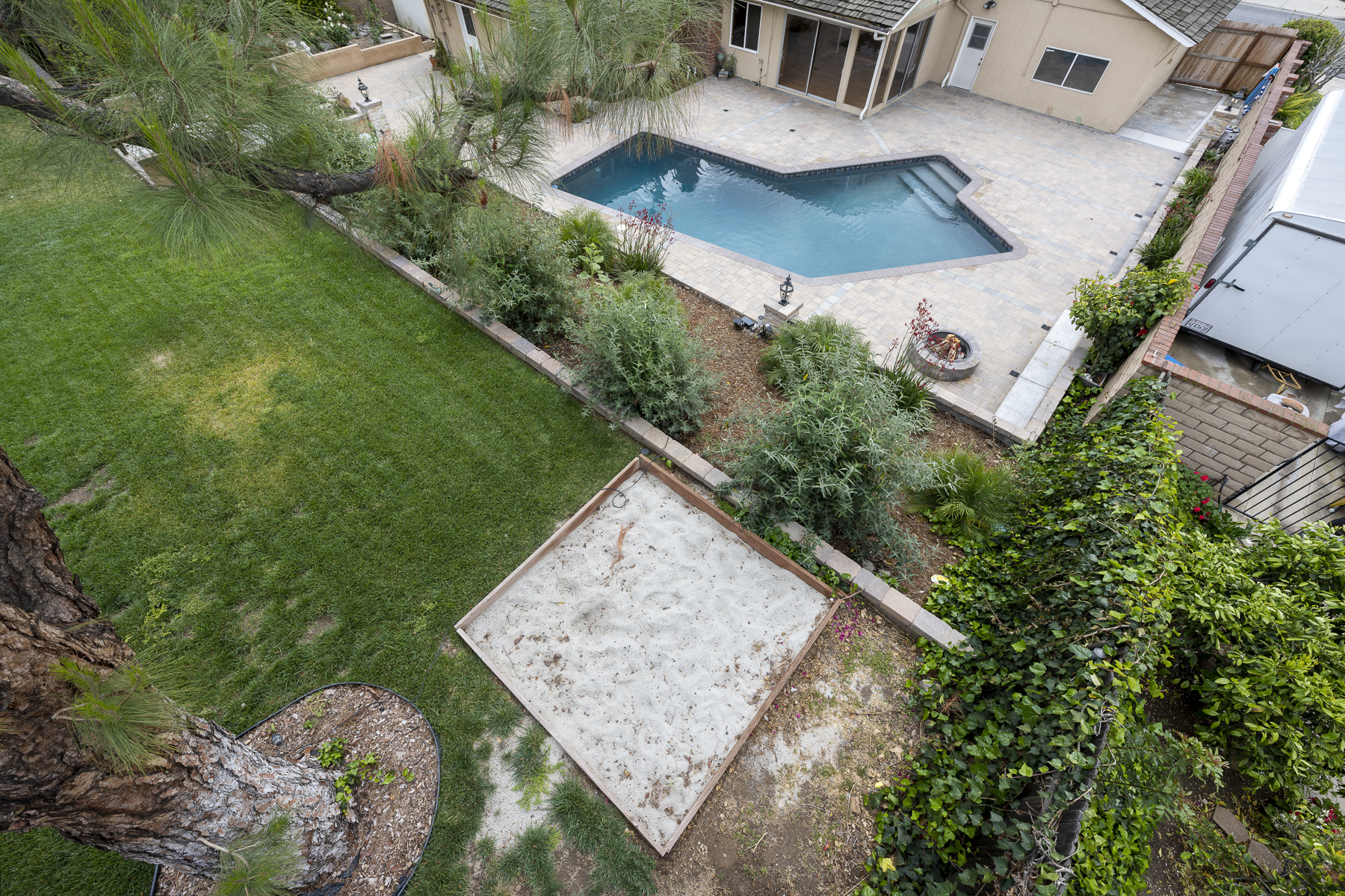 501 Dorothy Drive: Right aerial view of pool, landscape and green space with sandbox