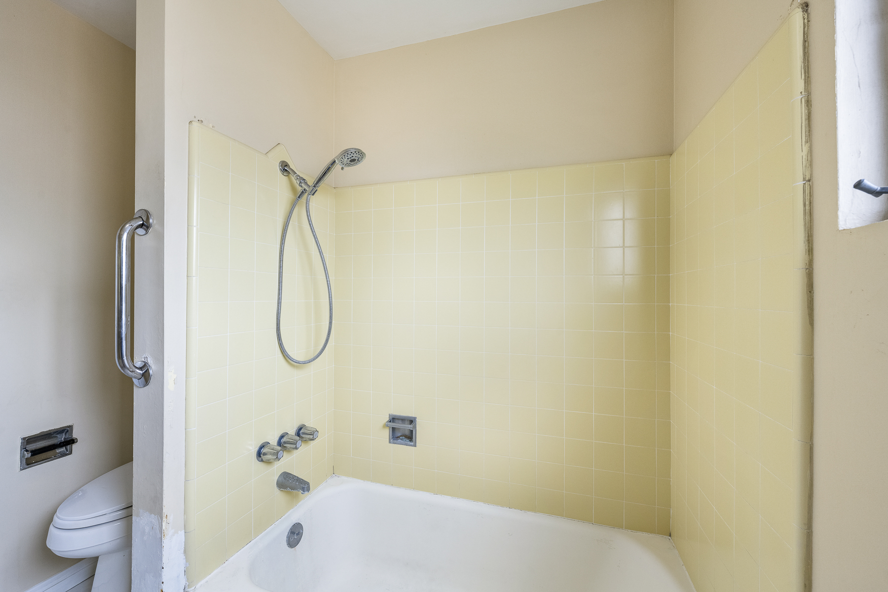 501 Dorothy Drive: Bathroom/shower with ivory tile and a handicap rail