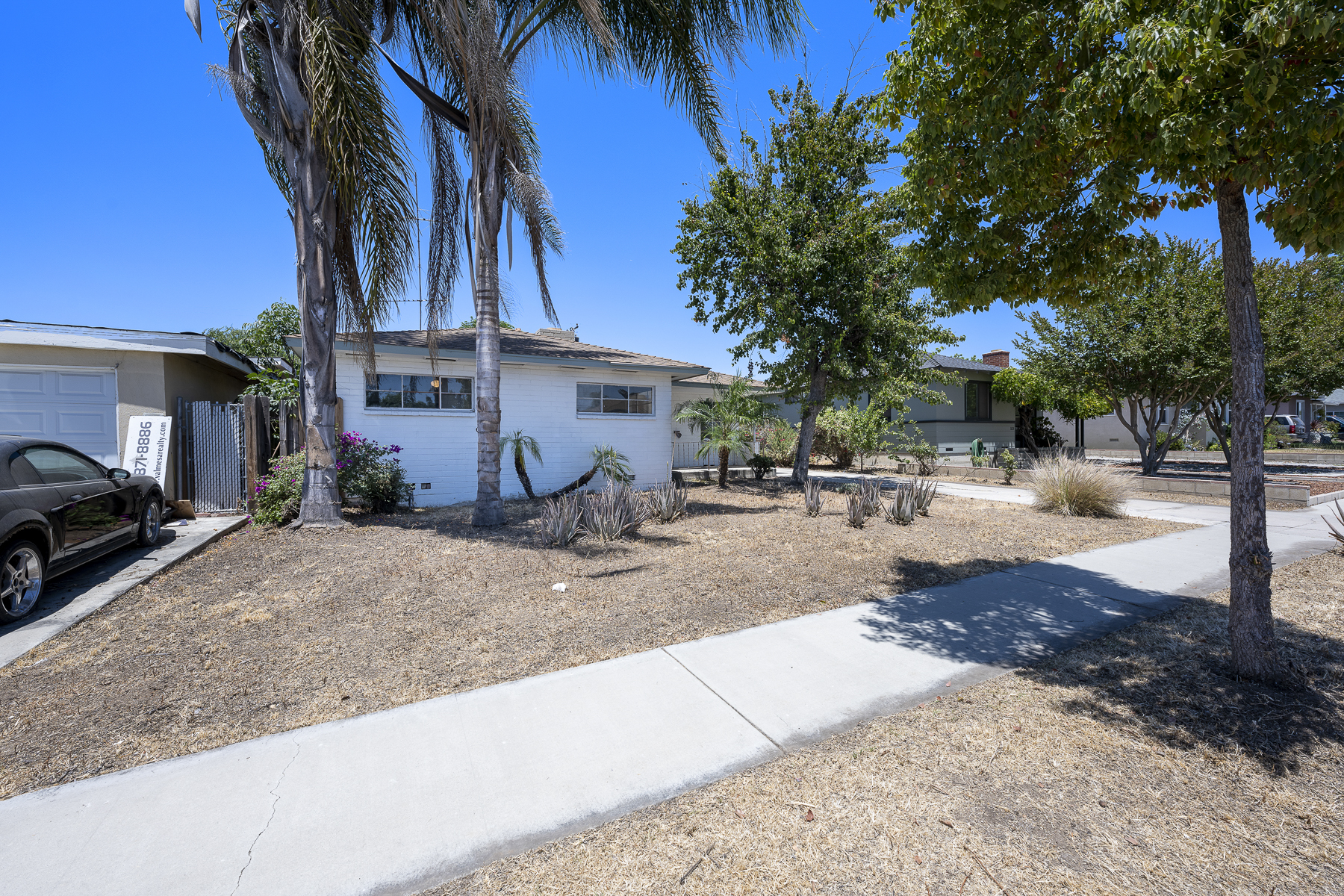 319 E. Francis Ave, La Habra, CA 90631: Exterior shot of front of house and yard, street view.