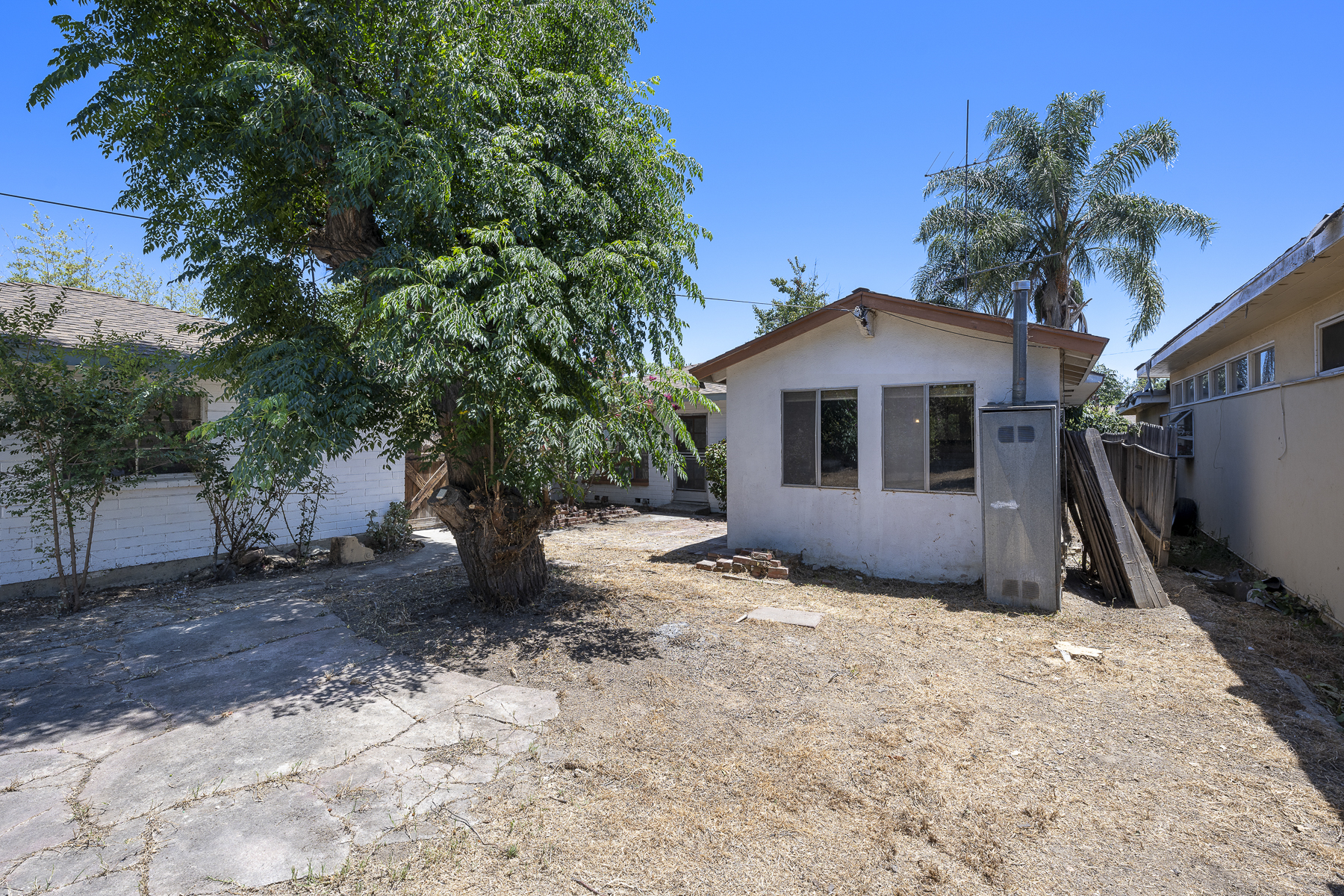 319 E. Francis Ave, La Habra, CA 90631: Exterior shot of backyard shed space and back of house.