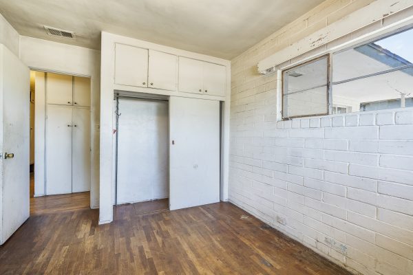 319 E. Francis Ave, La Habra, CA 90631: Interior white brick room, cabinets and window shot.
