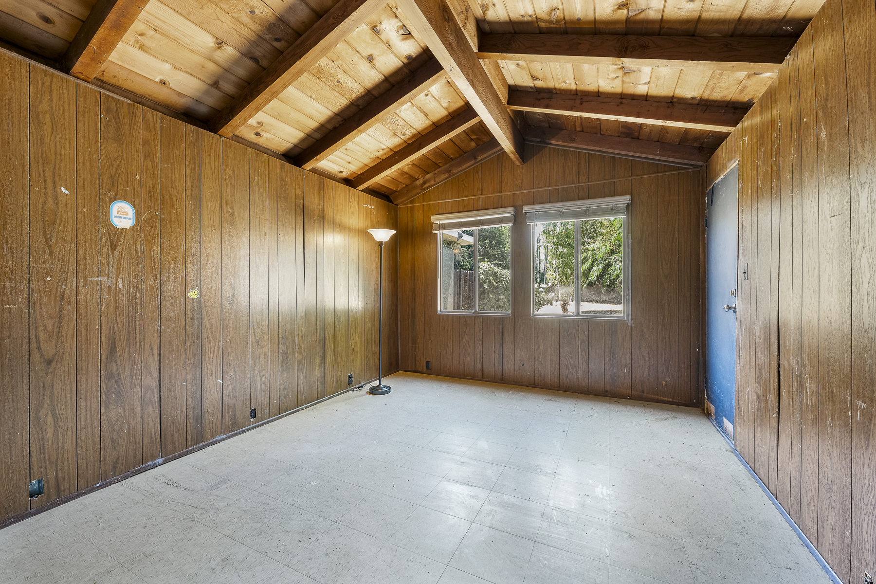 319 E. Francis Ave, La Habra, CA 90631: Wood panel room with blue door.