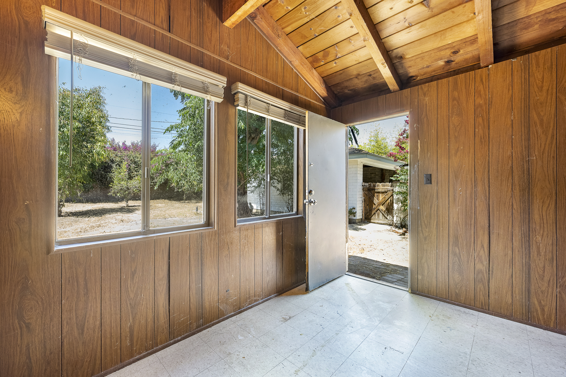 319 E. Francis Ave, La Habra, CA 90631: Wood panel room with view outdoors.