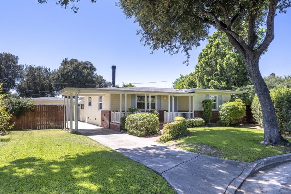 411 Truman Ave, Fullerton, CA 92832: Exterior view of front of house and side wooden fence.