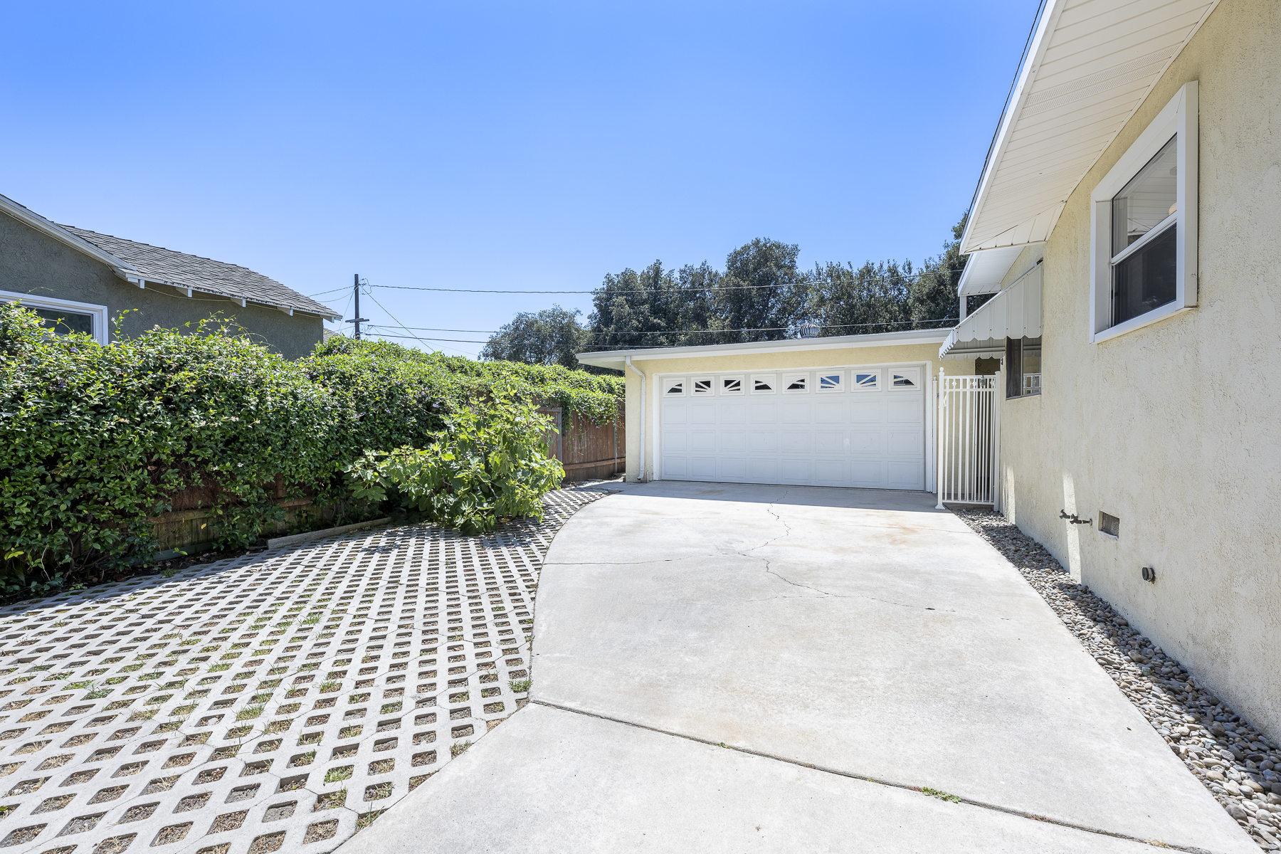 411 Truman Ave, Fullerton, CA 92832: Exterior view of garage and drive way.