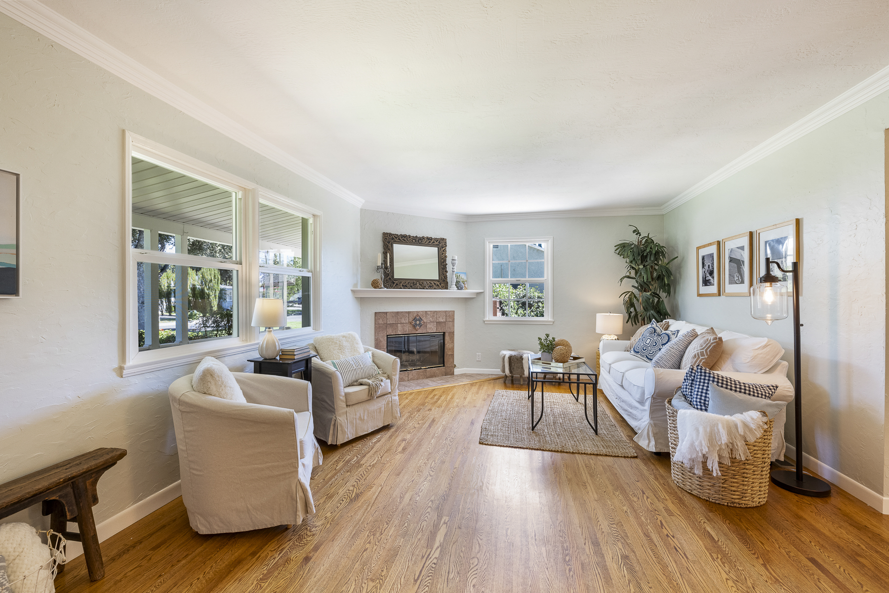 411 Truman Ave, Fullerton, CA 92832: Living Room with fireplace and exterior windows.