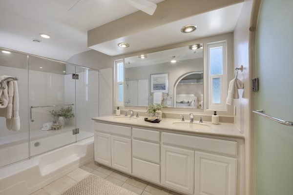 3424 Pinebrook Costa Mesa CA 92626: Full width view of bathroom with double vanity and shower.